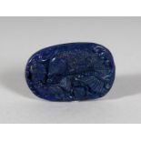A CHINESE CARVED LAPIS PENDANT.