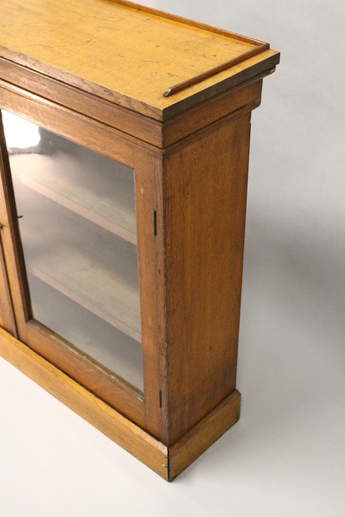 A VICTORIAN LIGHT OAK TWO-DOOR BOOKCASE, with a pair of glazed doors enclosing adjustable shelves, - Image 3 of 5