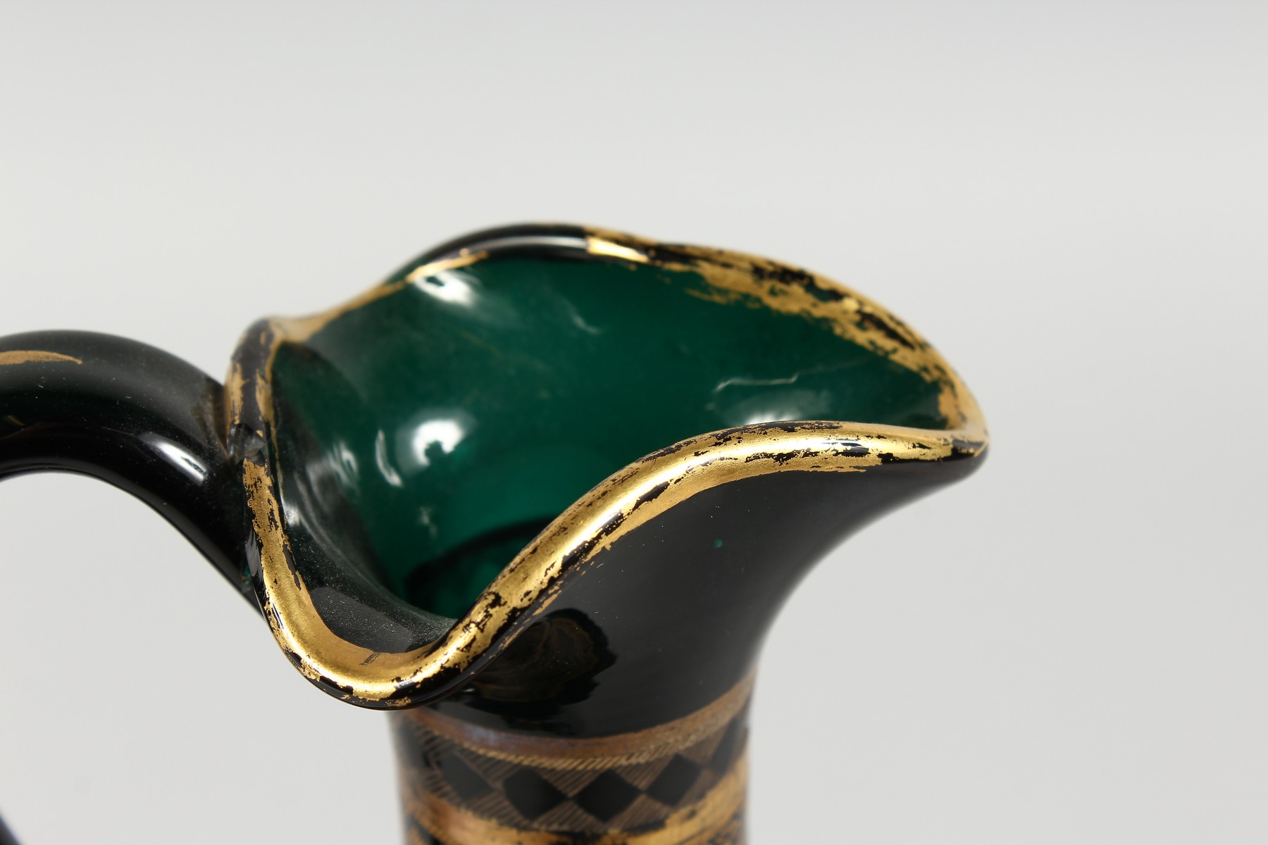 A CONTINENTAL DARK GREEN GLASS EWER AND STOPPER, with etched and gilded decoration. 14ins high. - Image 7 of 11