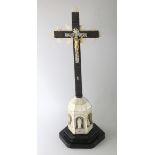 A GOOD MOTHER-OF-PEARL AND EBONY CORPUS ON A CROSS. 16ins high.