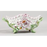 A GOOD MEISSEN OVAL PIERCED TWO-HANDLED BASKET, painted and encrusted with flowers with rustic