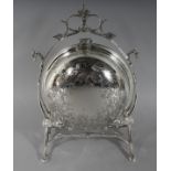 A SILVER PLATE CIRCULAR SHAPED BISCUIT AND CHEESE STAND. 11ins high.