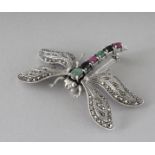 A SILVER, RUBY, EMERALD AND SAPPHIRE DRAGONFLY BROOCH.