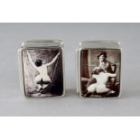 A PAIR OF SILVER EROTIC SCENE PILL BOXES.