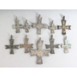 TEN SMALL ROMAN CROSSES.