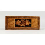 A TUNBRIDGE WARE PEN BOX, the top inlaid with flowers. 9ins long.