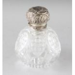 A LARGE VICTORIAN CUT GLASS SCENT BOTTLE with silver band and repousse top. London 1890. Maker: