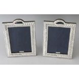 A PAIR OF SILVER PHOTOGRAPH FRAMES. 7.5ins x 5.25ins.