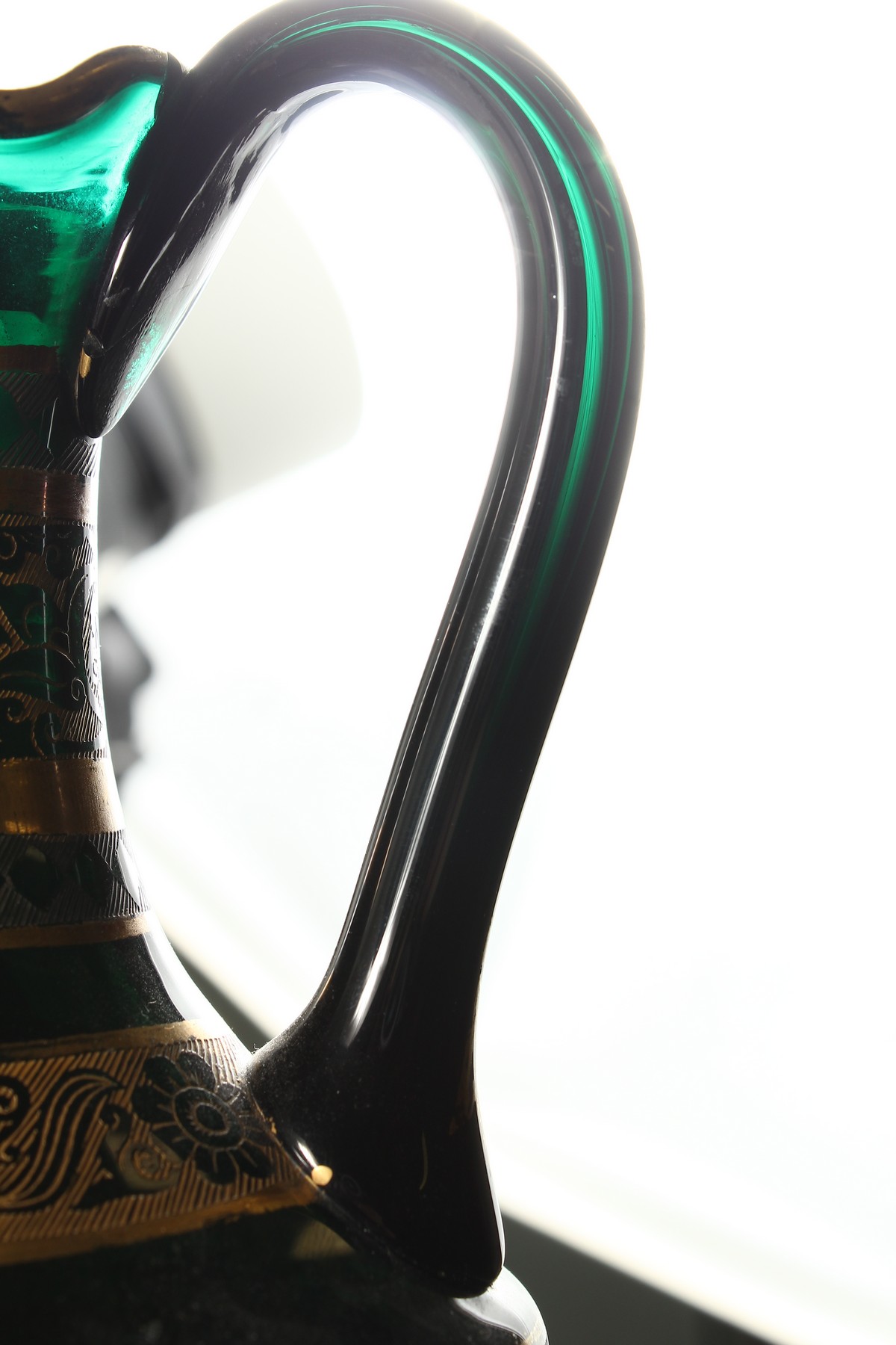 A CONTINENTAL DARK GREEN GLASS EWER AND STOPPER, with etched and gilded decoration. 14ins high. - Image 10 of 11