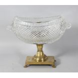 A GOOD HOBNAIL CUT BOAT SHAPED BASIN, with curling handles, on a brass base with claw feet. 9.5ins