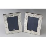 A PAIR OF SILVER PHOTOGRAPH FRAMES. 7.5ins x 5.5ins.