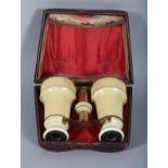 A PALAIS ROYAL IVORY CASED PAIR OF OPERA GLASSES. 3.25ins, closed.