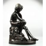GVE NOURLET (?) A GOOD LARGE BRONZE SCULPTURE, a young boy seated on a rock holding a lizard on