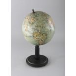 A COLUMBUS VOLKS GLOBE on a stand. 7ins diameter.