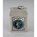 A VICTORIAN ENGRAVED SILVER VESTA CASE, Birmingham 1898, with an enamel half penny stamp.