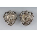 A PAIR OF SILVER PIERCED HEART SHAPED BONBON DISHES.