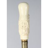 A CARVED BONE CHINAMAN HANDLE WALKING STICK. 36ins long.