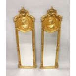 A LONG PAIR OF GILTWOOD MIRRORS. 5ft 8ins high x 1ft 9ins wide.