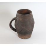 A LUBA CARVED CUP.