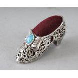 A SILVER OPAL SHOE PIN CUSHION. 2ins