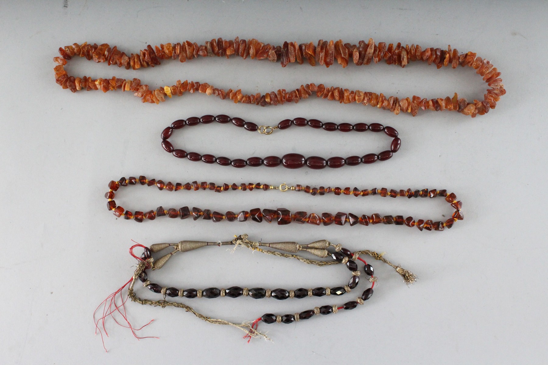 FOUR VARIOUS NECKLACES.