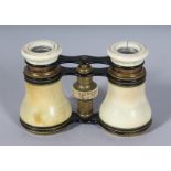 AN IVORY CASED PAIR OF OPERA GLASSES. 2.5ins, closed.