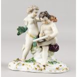 A 19TH CENTURY MEISSEN GROUP OF TWO PUTTI, Scribe. Cross swords mark in blue. 4.25ins high.