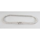 AN 18CT WHITE GOLD SEVENTY CLAW LINE DIAMOND BRACELET, 2.0cts.