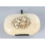 A BREVET CARVED IVORY PURSE. 3ins.