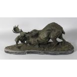 A LARGE BRONZE MOOSE on a marble base. Signed. 23ins long.