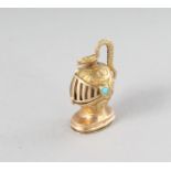 A TINY GOLD AND TURQUOISE HELMET AND SNAKE VINAIGRETTE.
