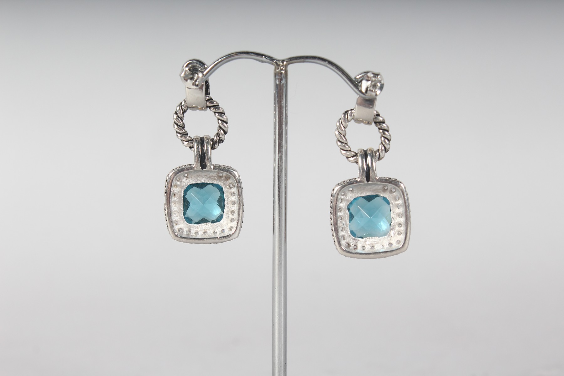 A PAIR OF SILVER AND BLUE TOPAZ EARRINGS. - Image 2 of 2