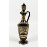 A CONTINENTAL DARK GREEN GLASS EWER AND STOPPER, with etched and gilded decoration. 14ins high.