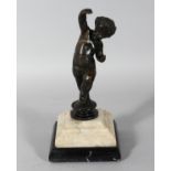AN 18TH CENTURY BRONZE CUPID on a marble base. 9.5ins high.