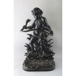 A LATE VICTORIAN CAST IRON STICK STAND, modelled as a young boy holding a snake. 2ft 8ins high x 1ft