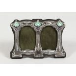 A SMALL ART NOUVEAU STYLE SILVER AND ENAMEL DOUBLE PHOTOGRAPH FRAME. 4.5ins x 3ins.