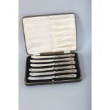 A SET OF SIX SILVER CASED BUTTER KNIVES. Sheffield 1901.