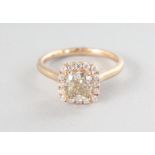 AN 18CT YELLOW GOLD SINGLE STONE CUSHION CHAMPAGNE DIAMOND RING, 1.24cts, surrounded by diamonds,