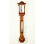 A GOOD VICTORIAN OAK CASED STICK BAROMETER by J. HUGHES, LONDON, with ivory in an architectural
