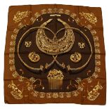 A HERMES SILK SCARF "LES CAVALIERS D'OR". 34ins x 34ins.