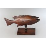 A CARVED WOOD PITCAIRN ISLAND FISH. 12ins long.