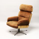 IN THE MANNER OF CHARLES EAMES, an office armchair, with brown draylon upholstered headrest, back