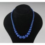 A BLUE LAPIS NECKLACE.