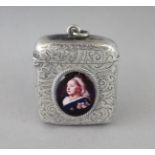 A VICTORIAN ENGRAVED SILVER VESTA CASE, Birmingham 1894, with an enamel oval of Queen Victoria.