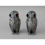 A PAIR OF CAST 800 OWL SALT AND PEPPERS. 2.5ins high.