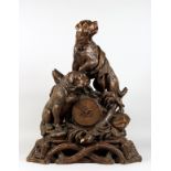 A VERY GOOD ANTIQUE BLACK FOREST CLOCK CARVED WITH TWO SAINT BERNARD DOGS