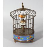 A SINGING BIRD IN A CAGE with cloisonne sides. 7.5ins high.