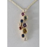 AN 18CT GOLD MULTI SAPPHIRE PENDANT on chain.