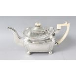 A GOOD GEORGE III IRISH SILVER TEAPOT with ivory finial and handle, engraved on four bun feet.