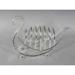 A SIX-DIVISION SWAN SHAPED TOAST RACK. 8ins long.
